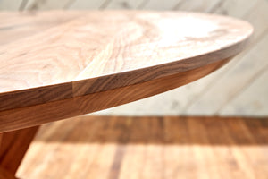 round walnut table with beveled edge