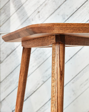 wood table with tapered edge profile