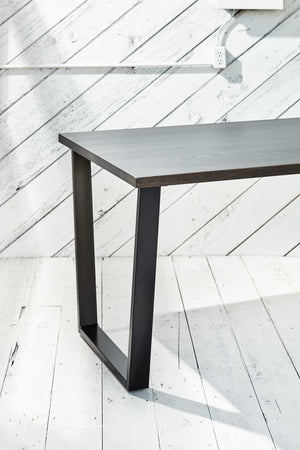 desk with metal trapezoid base