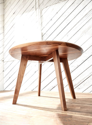 round wood table with angled legs